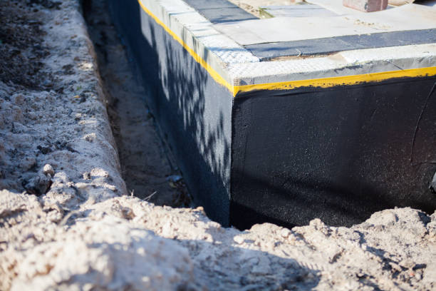 Professional Waterproofing technician working in Marcellus, MI